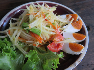 closed up papaya salad with salted egg