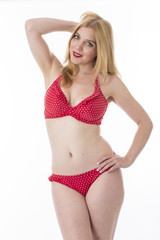 Obraz premium Attractive Young Woman Wearing a Red Polka Dot Bikini