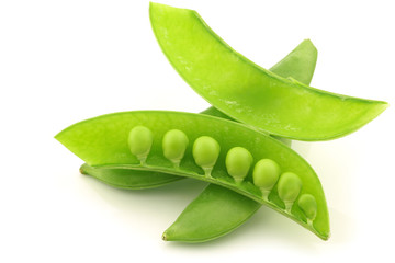 bunch of sugar snaps with one opened pod with peas visible