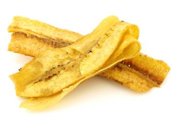 freshly baked banana chips on a white background