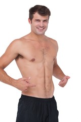 Fototapeta premium Fit shirtless man smiling at camera