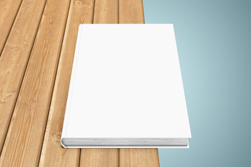 Texbook on the edge of table