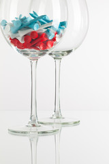 Two glasses of wine and golf equipments