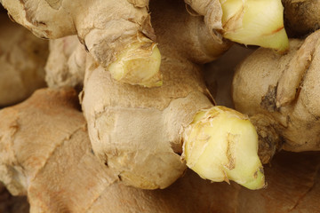 background of fresh pieces of ginger root