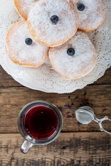 Sugary donuts and hibiscus red tea
