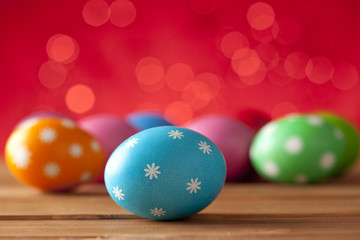 Colored Easter eggs on wooden background