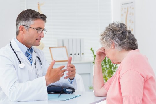 Doctor Talking To Tensed Patient