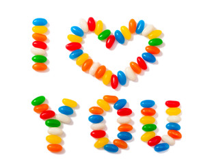 Sugar sprinkles on top of  icing birthday cake.