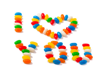 Sugar sprinkles on top of  icing birthday cake.