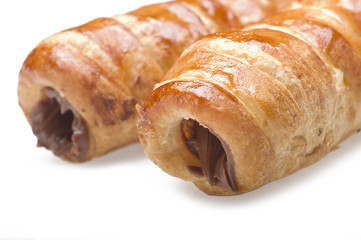 Italian cannoli filled with egg custard on white background