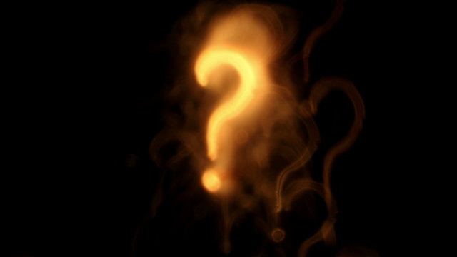 Question marks. Out of focus lights background.