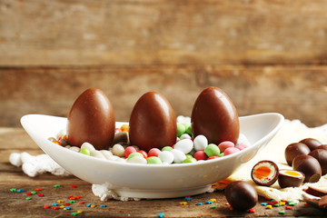 Chocolate Easter Eggs on wooden background