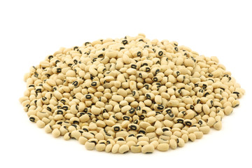 bunch of black eyed peas on a white background