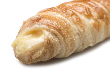 Italian cannoli filled with egg custard on white background