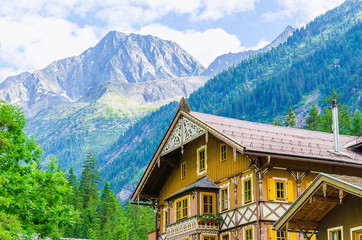 Fototapeta na wymiar Wooden cottage on the background of the Alps, Zillertal