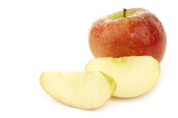 braeburn apple and some pieces on a white background