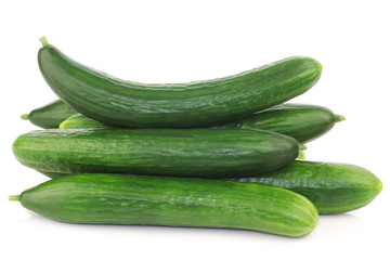 bunch of fresh cucumbers on a white background