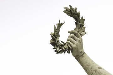 Laurel Wreath hand held by a bronze statue on white background