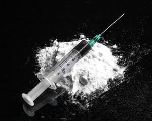Drug syringe and cooked heroin on spoon - obrazy, fototapety, plakaty
