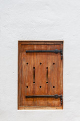 Wooden hatch window in a historic Cape Dutch building