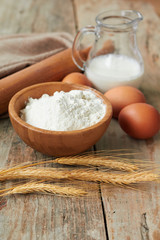 Obraz na płótnie Canvas Baking ingredients: eggs, milk, flour, rolling pin