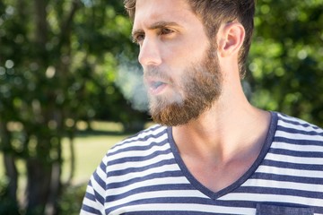 Fototapeta premium Hipster smoking electronic cigarette