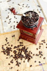 Coffee beans scattered upon the old map
