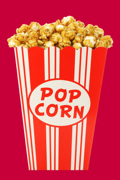 caramel popcorn in a decorative paper popcorn cup