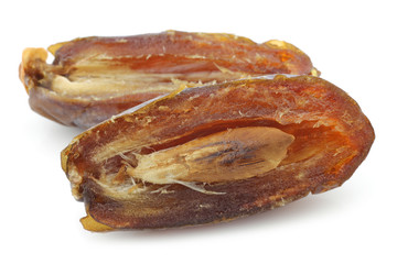 bunch of dried dates on a white background