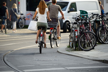 Fototapeta na wymiar People on bikes in traffic