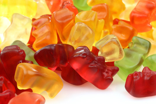 bunch of colorful gummy bears on a white background