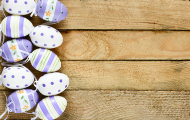 Fototapeta na wymiar Decorated Easter eggs on rustic wooden background