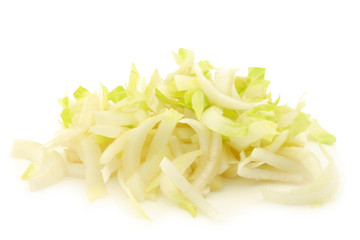 freshly cut pieces of chicory on a white background