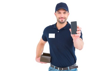 Handsome delivery man showing mobile phone