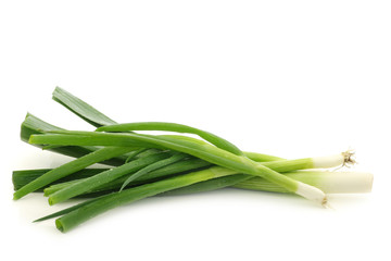 Fresh cut leek and spring onions on a white background