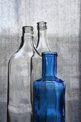 Three crystal bottles agains a clear background