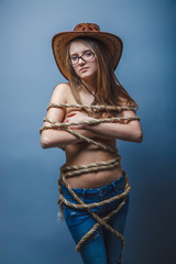 European-looking girl of twenty years in glasses wrapped with ro - obrazy, fototapety, plakaty