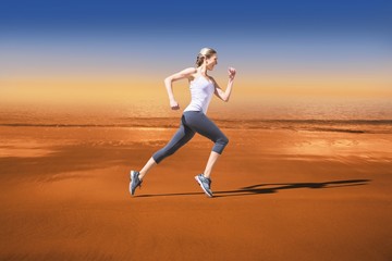 Fototapeta na wymiar Composite image of pretty fit blonde jogging