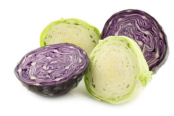 cut red cabbage and cut green pointed cabbage on a white backgro