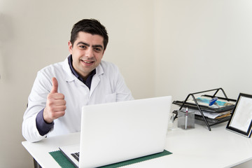 Portrait Of Male Doctor With Netbook
