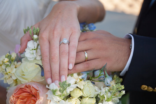 wedding ring hand finger over flower