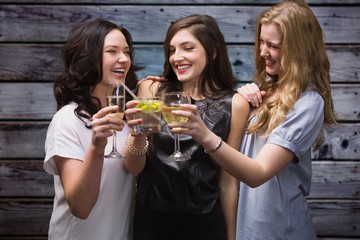 Composite image of friends with drinks