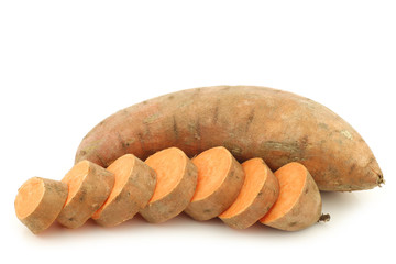 sweet potato and a cut one on a white background