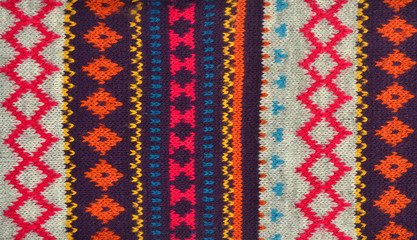 Knit woolen texture.Colorful geometric shapes pattern background