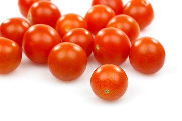 fresh whole cherry tomatoes on a white background
