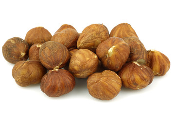 bunch of fresh hazelnuts on a white background