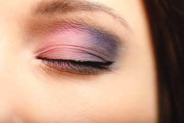 Naklejka premium Part of woman face eye with eyeshadow makeup detail.