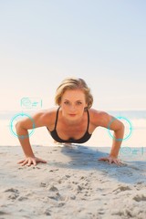 Composite image of fit blonde in plank position on the beach