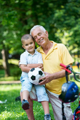 grandfather and child have fun  in park