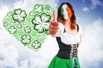 Composite image of irish girl showing thumbs up
